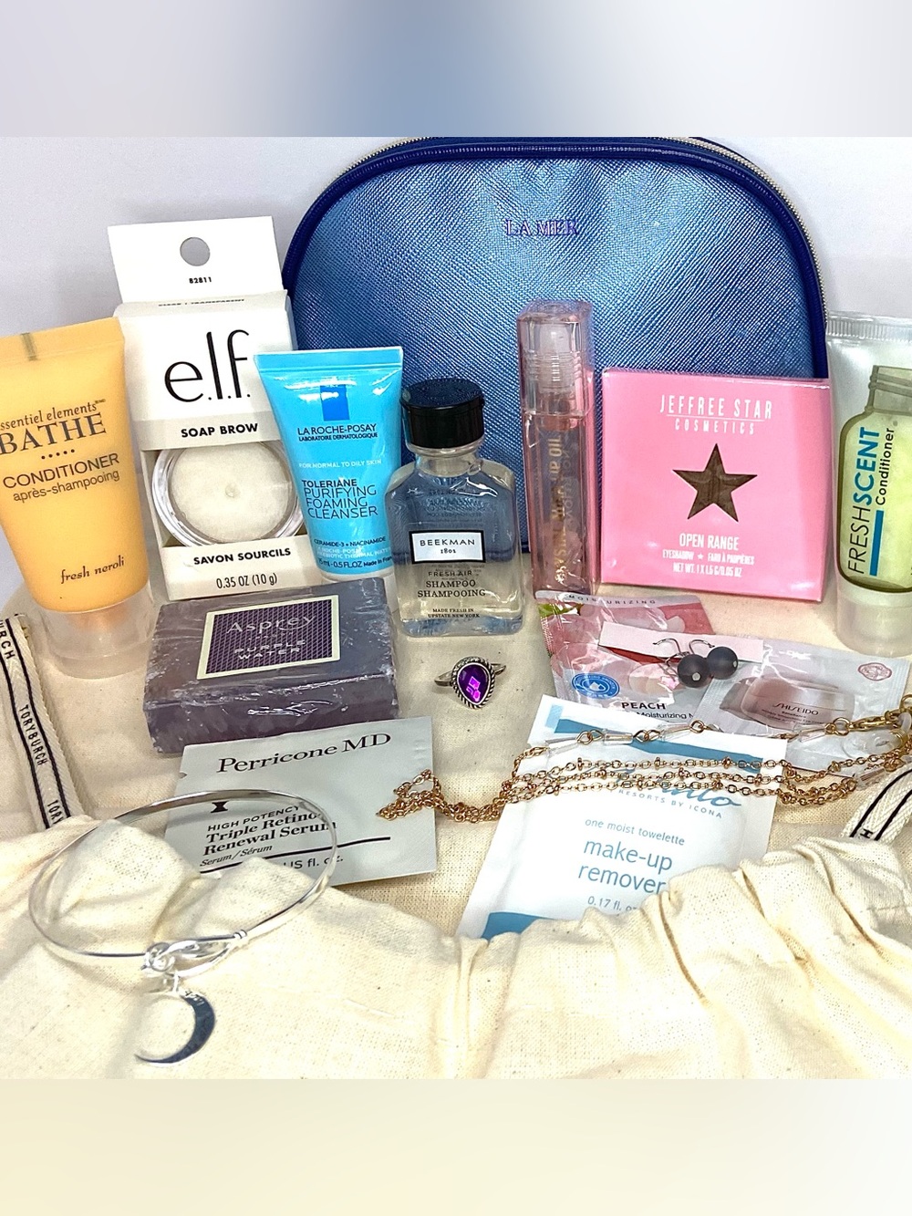 18 total LA MER Blue Pouch with Assorted Beauty Samples free Tory dust bag - Picture 2 of 5